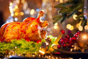 Christmas dinner. Holiday decorated table with roasted turkey
